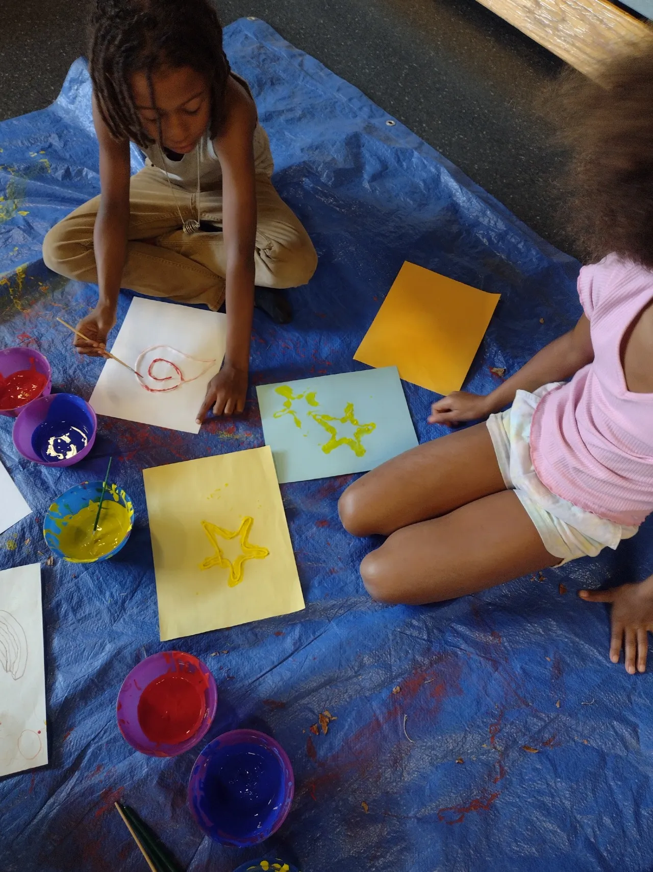 Kids painting on paper
